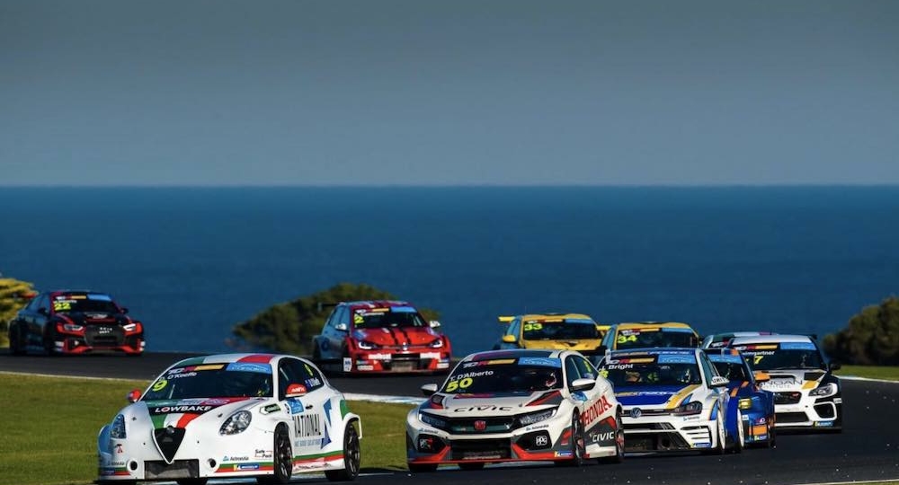 touring car racing series cars with ocean