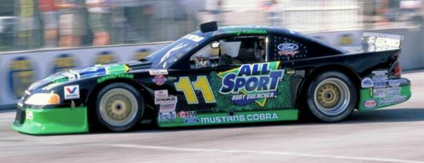 1997 trans am mustang on the race track