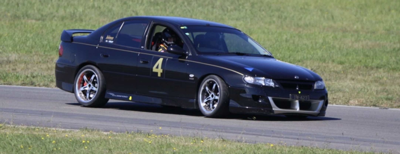 driving a performance car on a race track